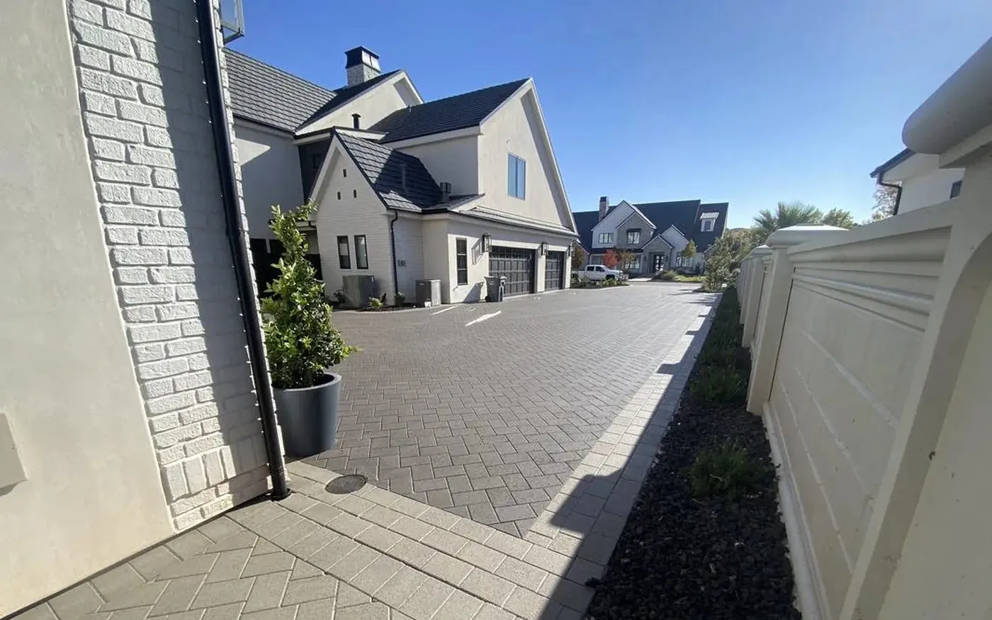 Luxury sealed herringbone paver driveway in Southern Utah by Nichols Concrete Sealing