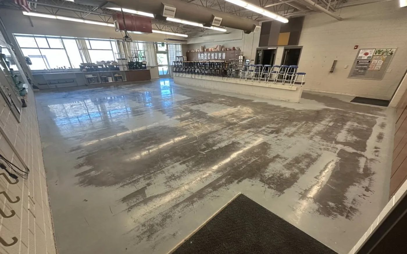 Before shot blast commercial concrete floor — Nichols Concrete Sealing